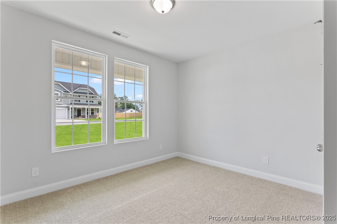 3117 Wolfpack Lane Eastover, NC 28312 - Photo 13 of 45 a view of an empty room with a window
