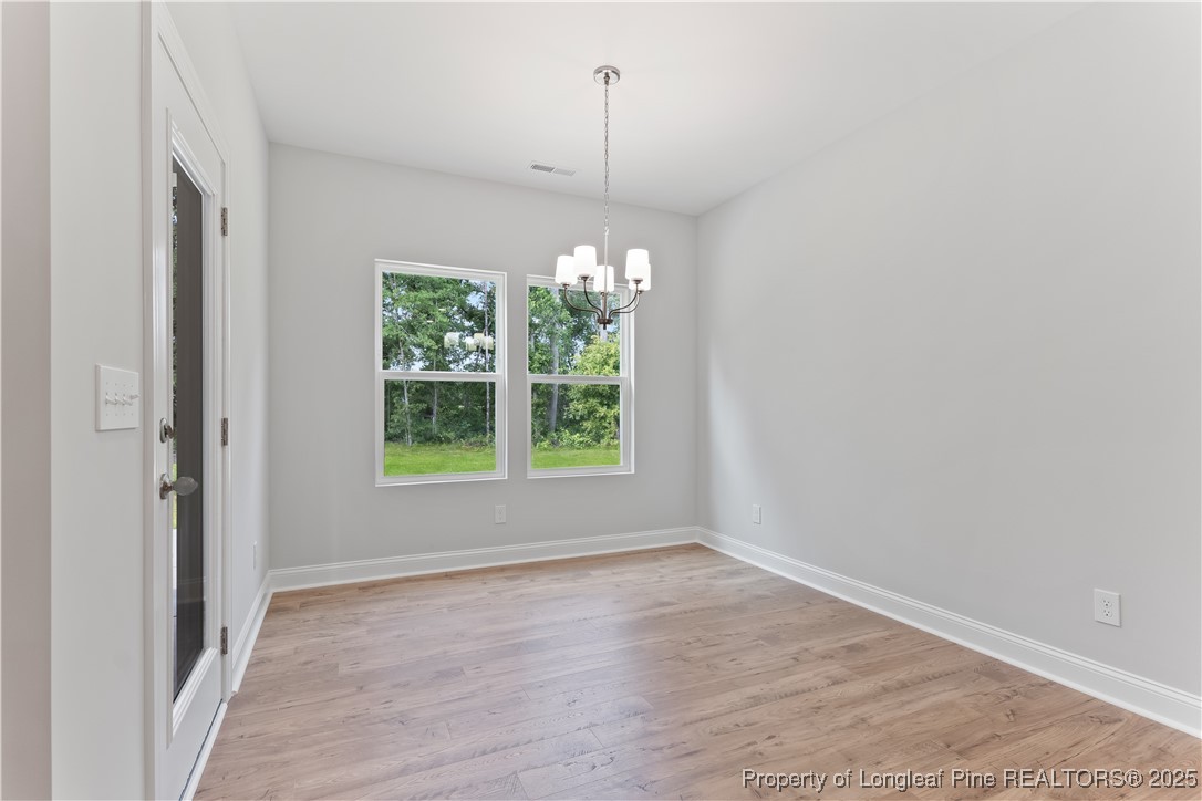3117 Wolfpack Lane Eastover, NC 28312 - Photo 23 of 45 a view of a room with window wooden floor and outdoor view