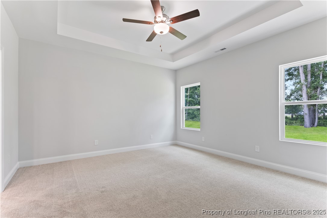 3117 Wolfpack Lane Eastover, NC 28312 - Photo 26 of 45 an empty room with windows and fan