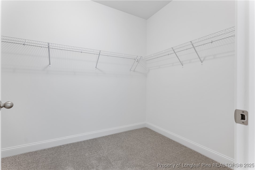 3117 Wolfpack Lane Eastover, NC 28312 - Photo 33 of 45 a view of a room with racks on the wall