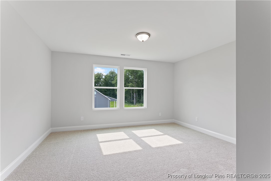 3117 Wolfpack Lane Eastover, NC 28312 - Photo 38 of 45 an empty room with a window