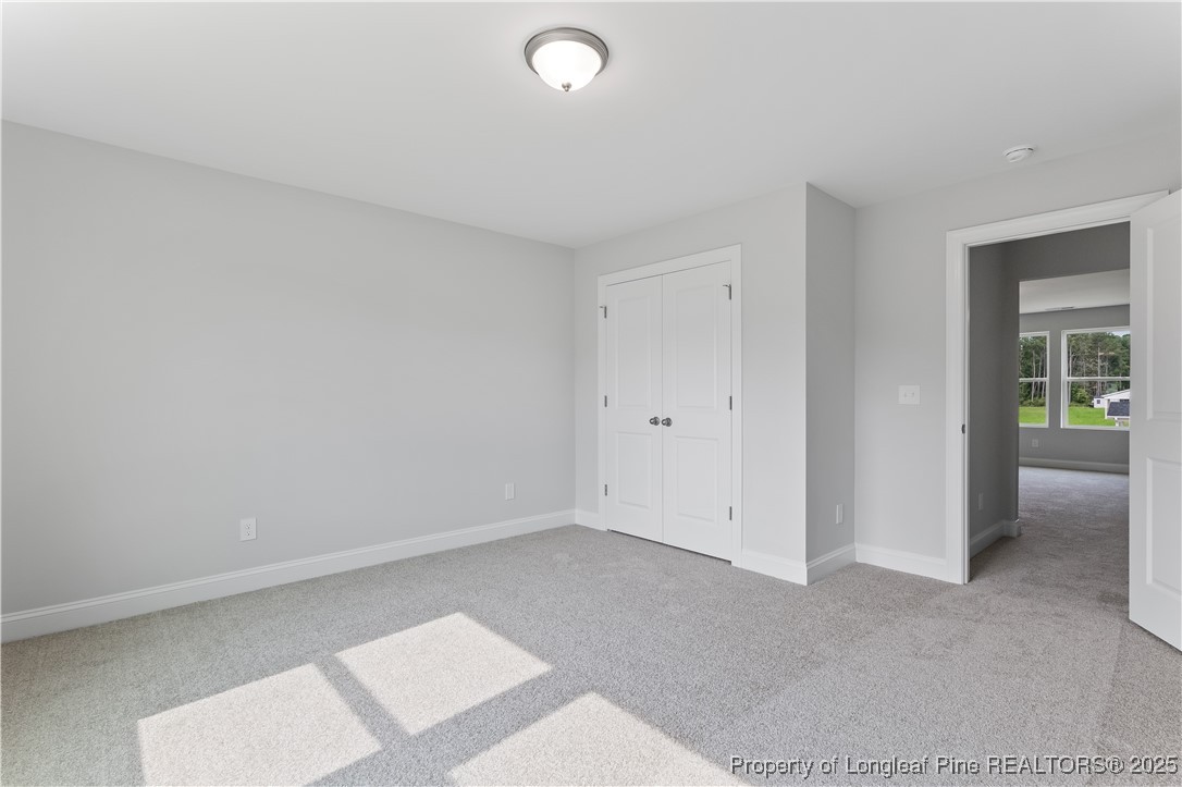 3117 Wolfpack Lane Eastover, NC 28312 - Photo 39 of 45 an empty room with windows