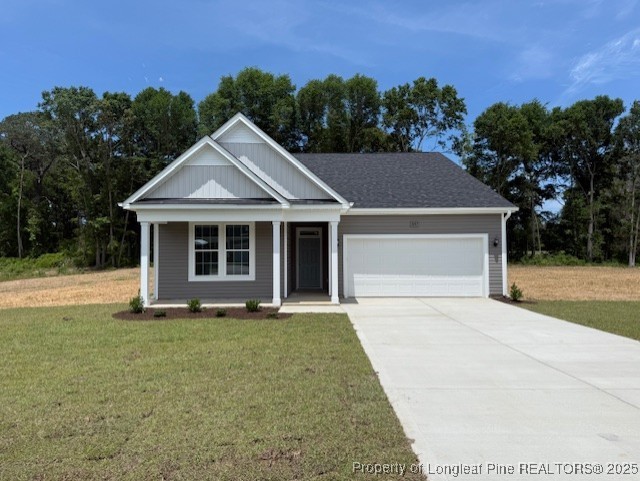 3117 Wolfpack Lane Eastover, NC 28312 - Photo 40 of 45 a front view of a house with a yard and trees