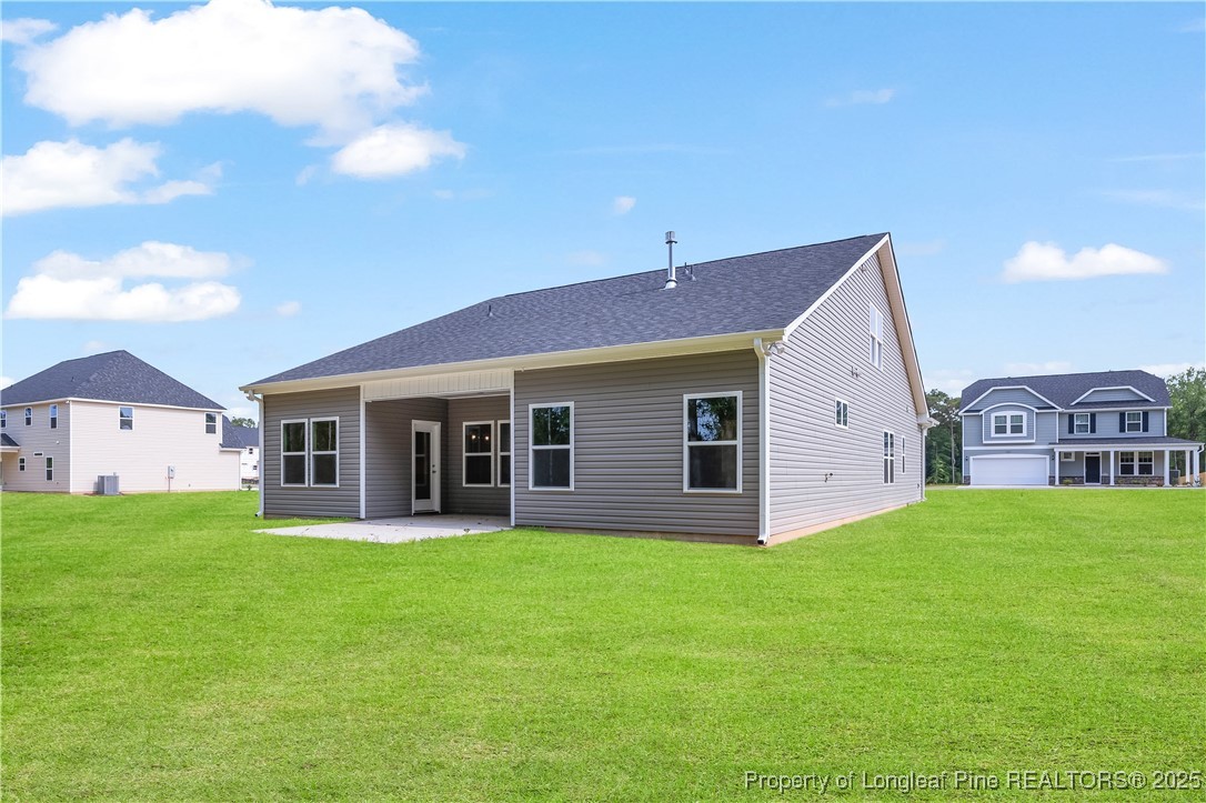 3117 Wolfpack Lane Eastover, NC 28312 - Photo 5 of 45 a front view of house with yard and green space