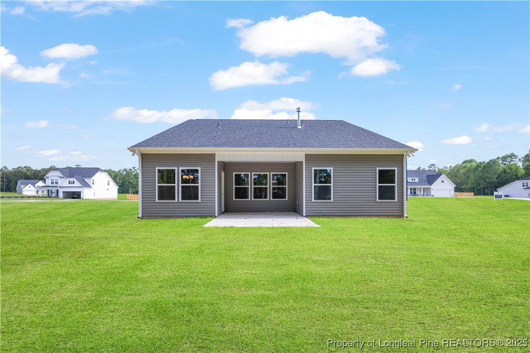 3117 Wolfpack Lane Eastover, NC 28312 - Photo 6 of 45 a front view of a house with a garden