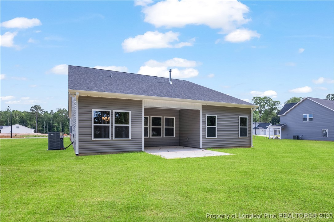 3117 Wolfpack Lane Eastover, NC 28312 - Photo 7 of 45 a front view of house with yard and outdoor seating