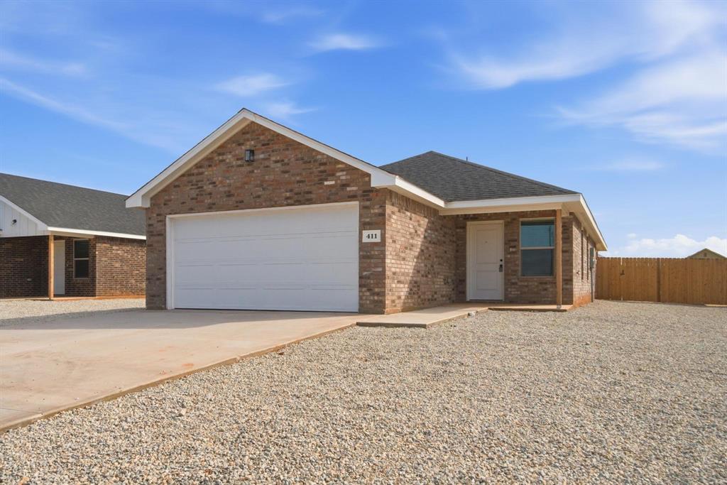 4165 Ranger Road Abilene, TX 79601 - Photo 1 of 10 Single story home with concrete driveway, brick siding, a garage, and roof with shingles