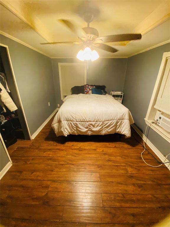 1670 Shiloh Street Paris, TX 75460 - Photo 11 of 11 Bedroom featuring hardwood / wood-style flooring, ornamental molding, and ceiling fan