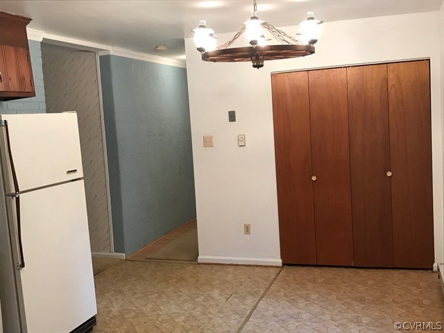 11516 2nd Branch Road Chesterfield, VA 23838 - Photo 4 of 10 a view of a refrigerator in kitchen and an empty room