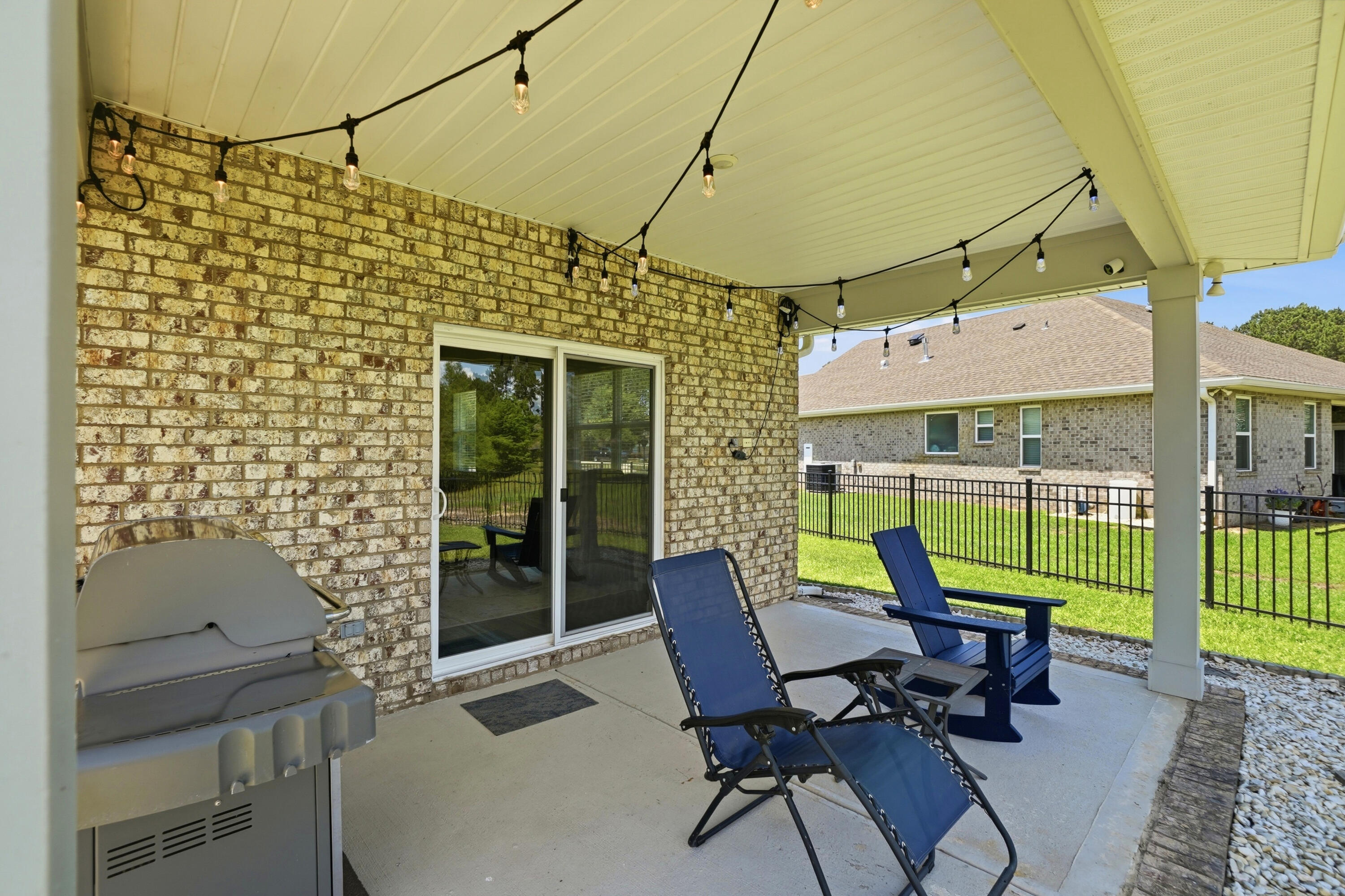 525 Windchime Way Freeport, FL 32439 - Photo 30 of 59 a view of a chairs and table in patio with a fire pit