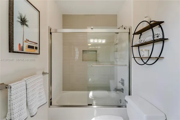 a bathroom with a bathtub and a shower