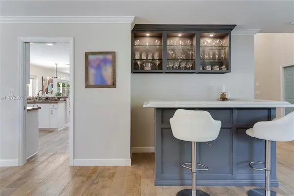 a kitchen with a table and cabinets