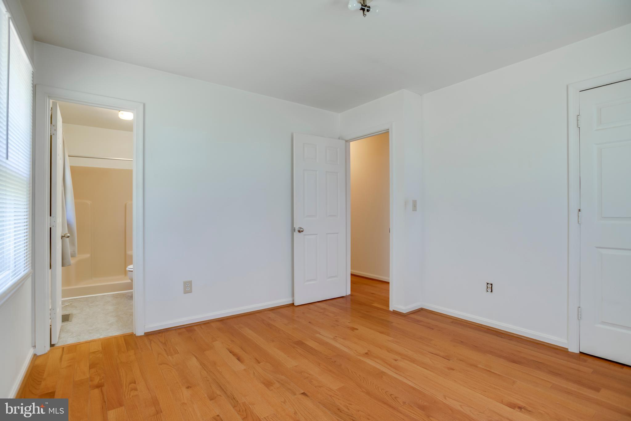 803 Weaver Hollow Road Banco, VA 22711 - Photo 13 of 67 a bedroom with a bed and wooden floor