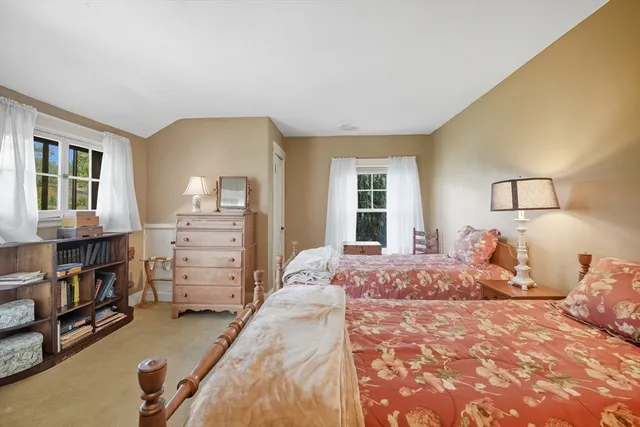 a bedroom with a bed furniture and a window