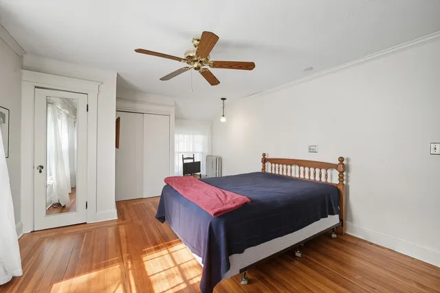 a bedroom with a bed and window
