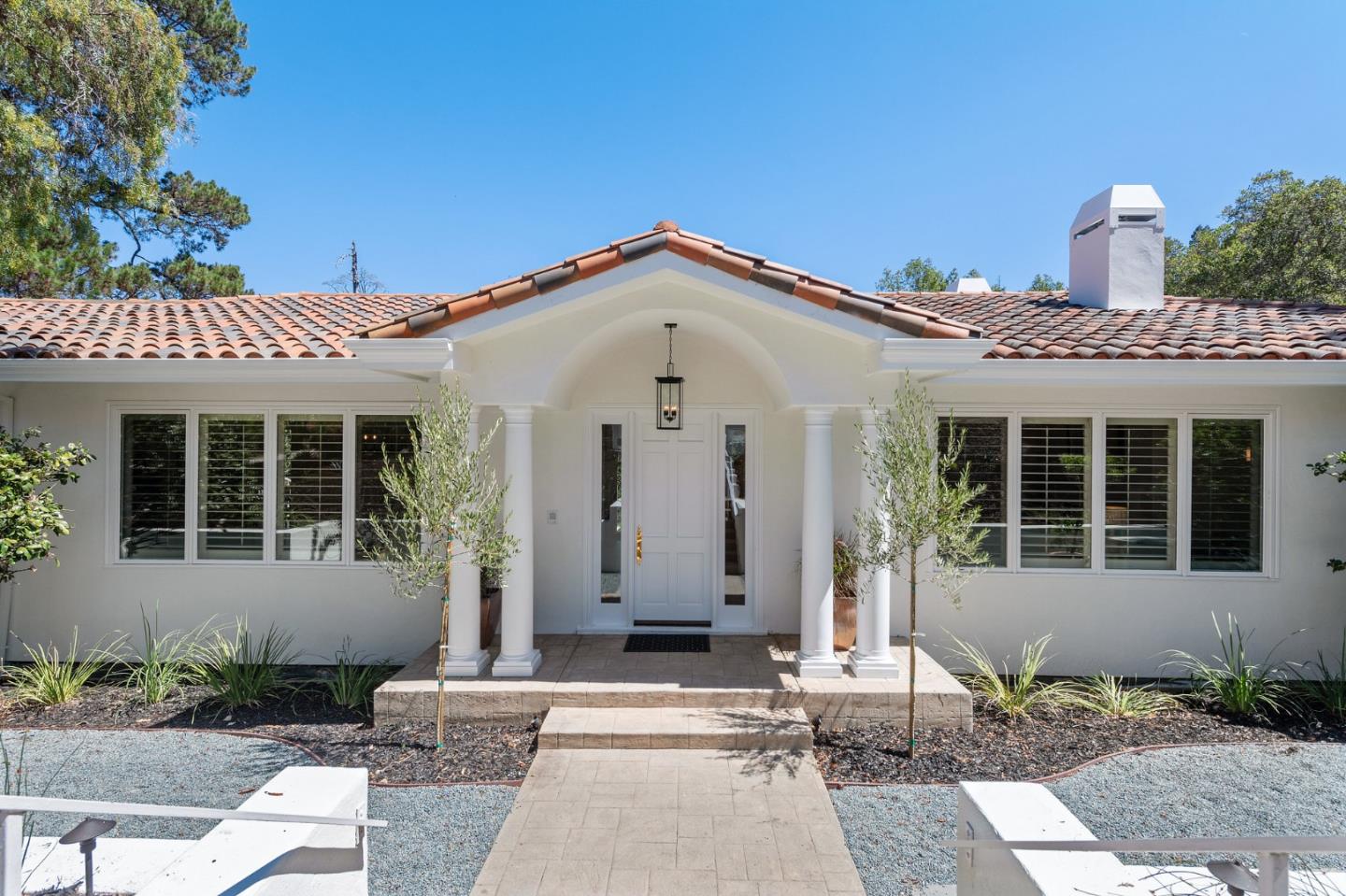 a front view of a house with a yard
