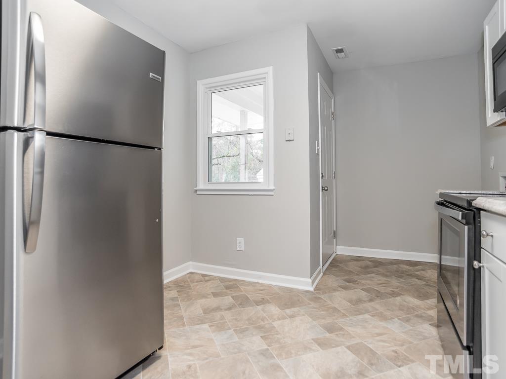 512 Dacian Road Raleigh, NC 27610 - Photo 13 of 19 a view of an empty room with a window