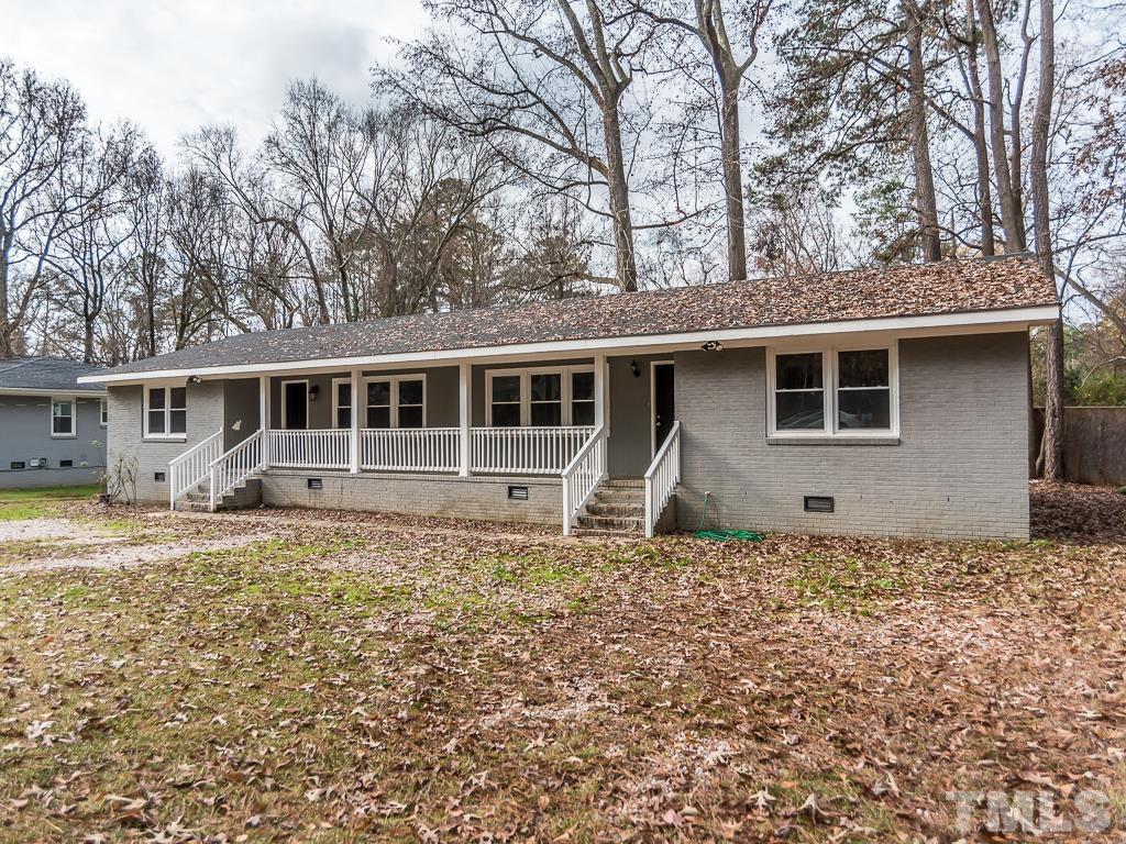 512 Dacian Road Raleigh, NC 27610 - Photo 18 of 19 a house with trees in the background