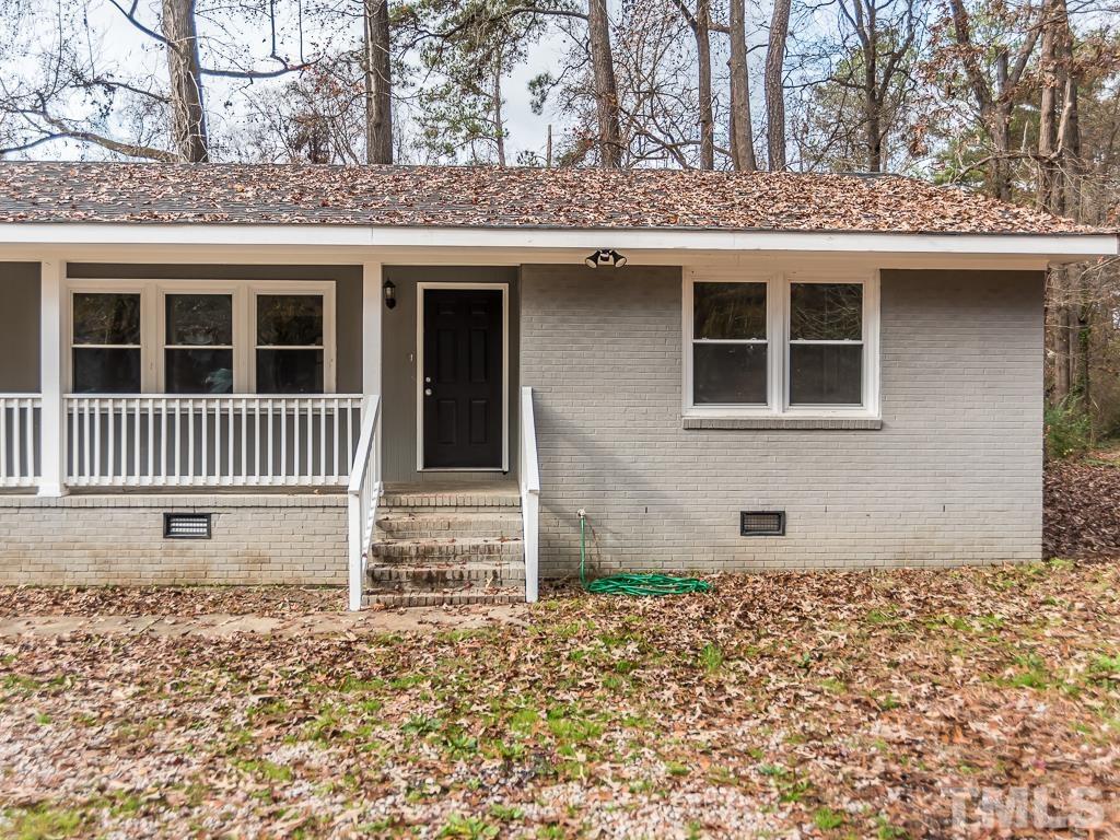 512 Dacian Road Raleigh, NC 27610 - Photo 3 of 19 a front view of a house with a garden