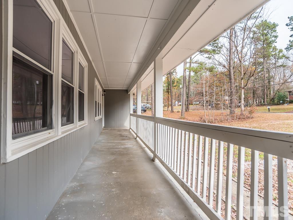 512 Dacian Road Raleigh, NC 27610 - Photo 4 of 19 a view of a porch with a floor to ceiling window and a city view
