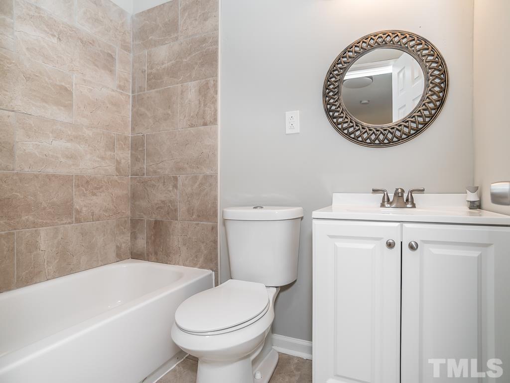 512 Dacian Road Raleigh, NC 27610 - Photo 8 of 19 a bathroom with a toilet and a sink