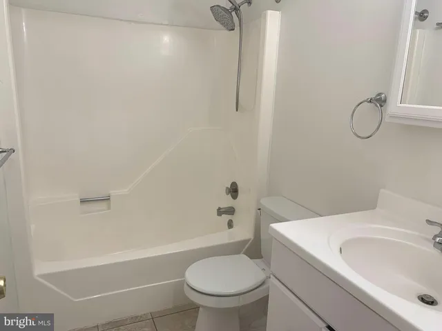 a bathroom with a sink a toilet and a bathtub