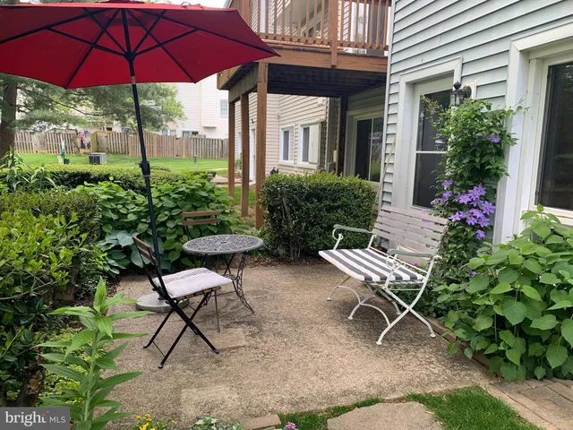 a garden view with a seating space