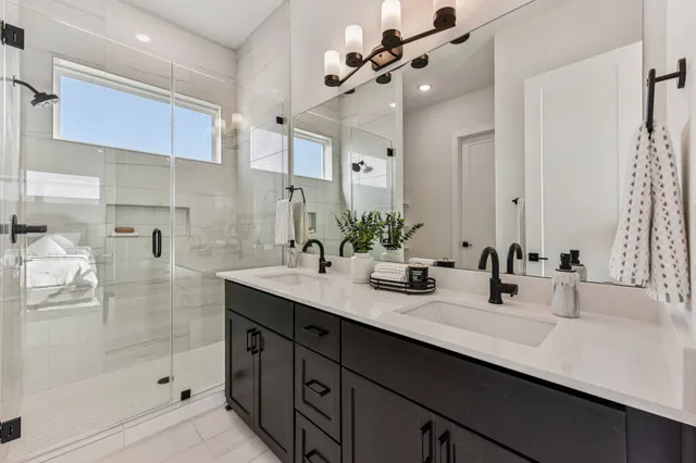 a bedroom with a bed and painting on the wall