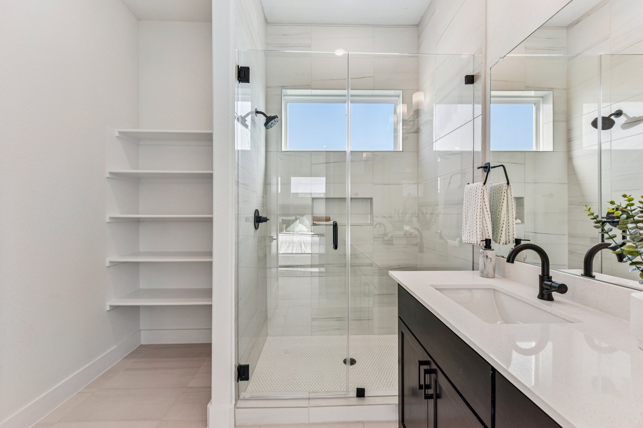 12105 Cearley Drive Austin, TX 78758 - Photo 19 of 40 a bathroom with a sink a toilet and shower