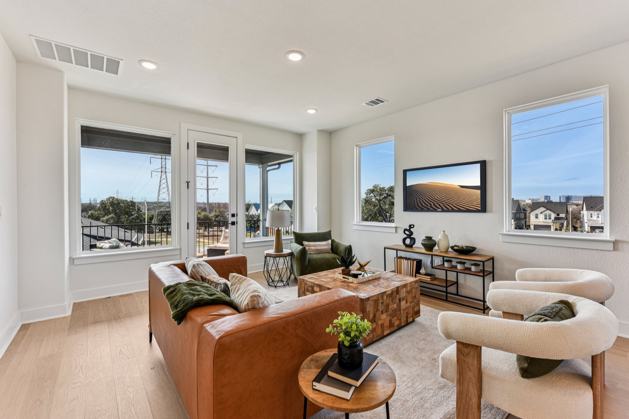 12105 Cearley Drive Austin, TX 78758 - Photo 20 of 40 a living room with furniture and a flat screen tv