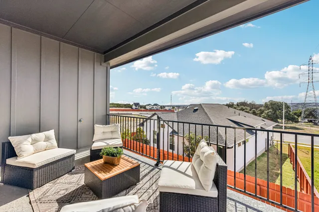 a view of a balcony with furniture
