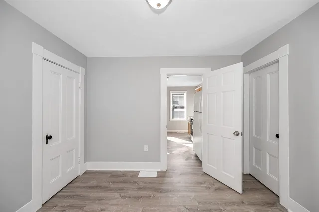 wooden floor with white walls