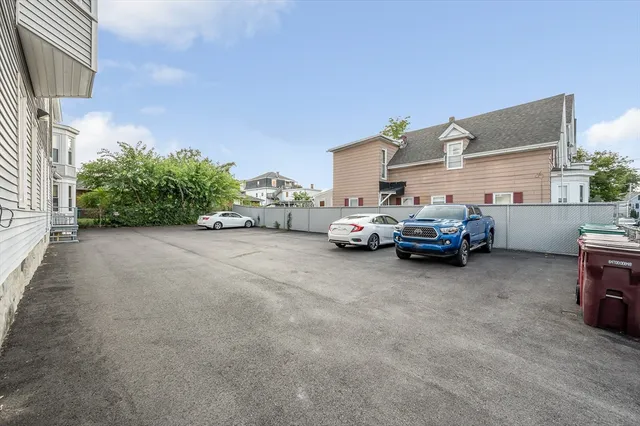 a couple of cars parked in a parking lot