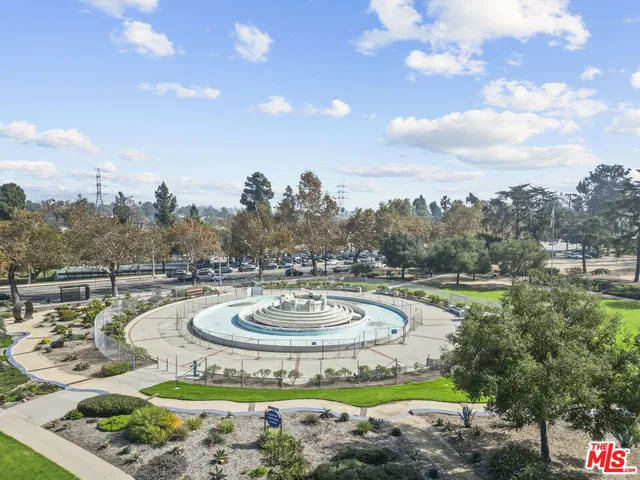 a view of a swimming pool with a yard