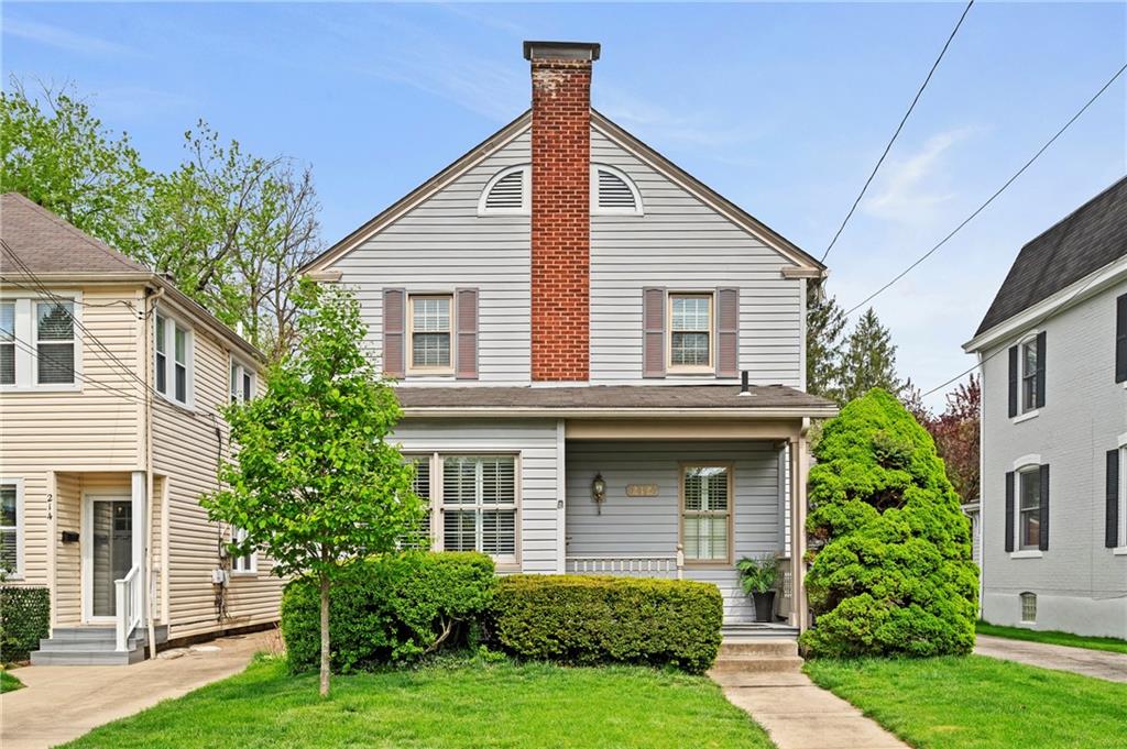 Classic two-story home with a welcoming front porch and timeless curb appeal. Manageable yard and traditional design support an easy, low-maintenance lifestyle.