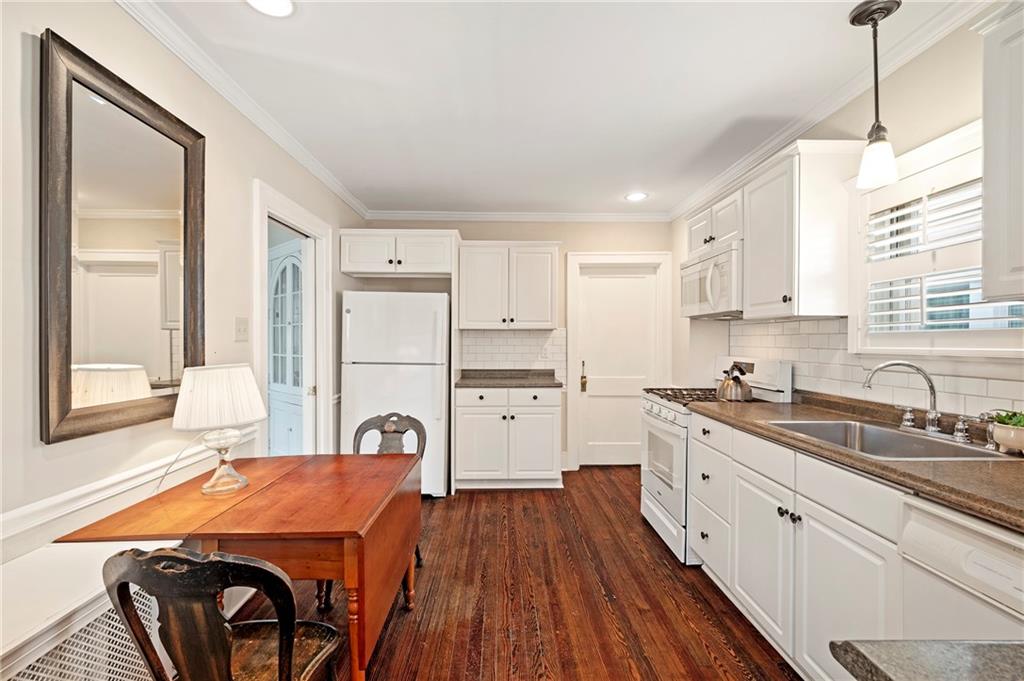 212 Pine Road Sewickley, PA 15143 - Photo 13 of 33 Functional kitchen with excellent workflow, ample prep space, and room for a casual eat-in setup. Direct access to the mudroom supports an easy, organized daily routine.