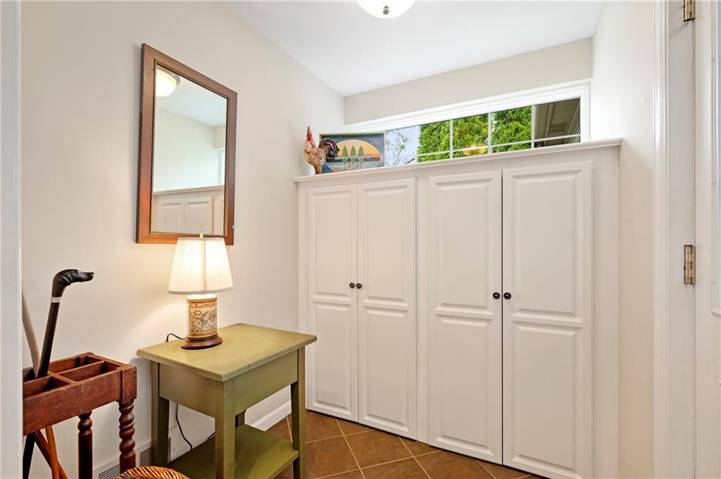 212 Pine Road Sewickley, PA 15143 - Photo 14 of 33 Practical mudroom with built-in storage cabinetry to keep coats, shoes, and everyday essentials neatly organized. A functional transition space designed to simplify daily routines and keep the main living areas clutter-free.