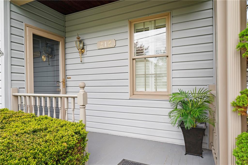 212 Pine Road Sewickley, PA 15143 - Photo 2 of 33 The front entry features a covered porch and classic details that create a warm, welcoming first impression. A charming space that enhances curb appeal and offers a pleasant transition into the home.