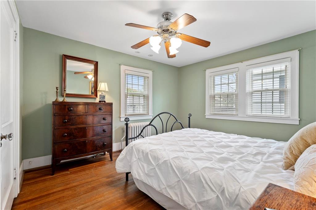 212 Pine Road Sewickley, PA 15143 - Photo 22 of 33 This bedroom offers hardwood floors and a comfortable layout that supports restful living. A versatile space well-suited for guests, family, or a home office.