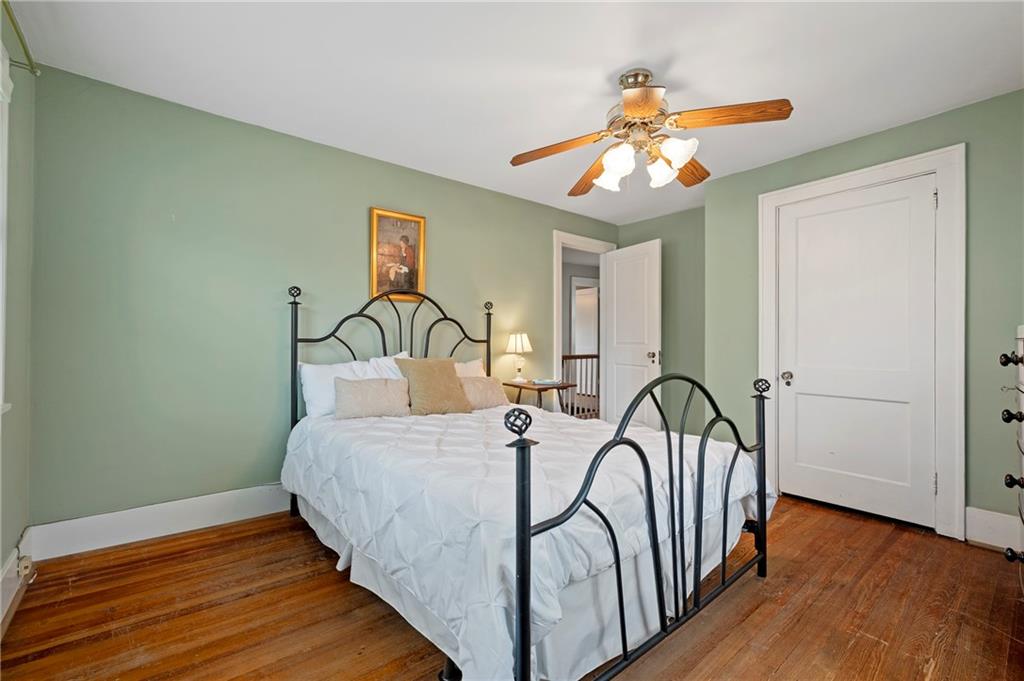 212 Pine Road Sewickley, PA 15143 - Photo 23 of 33 This bedroom features multiple windows that bring in natural light and create a bright, comfortable atmosphere. The layout supports flexible use, ideal for guests, family, or a work-from-home setup.
