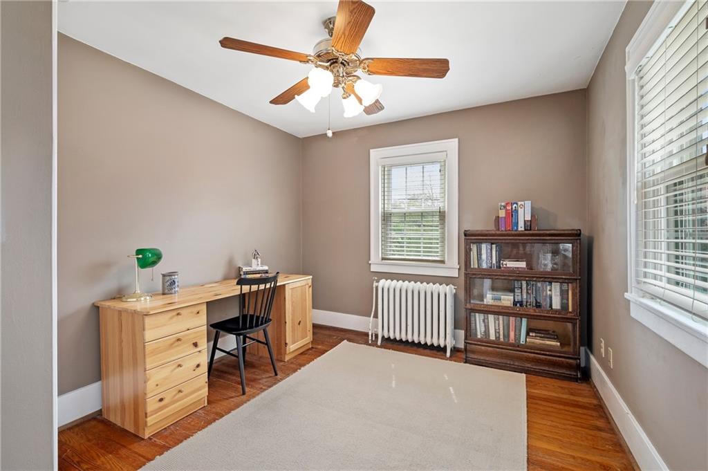 212 Pine Road Sewickley, PA 15143 - Photo 24 of 33 This flexible room offers hardwood floors, natural light, and space for a desk or guest setup. Ideal for a home office, study, or additional bedroom to support today’s work-from-home lifestyle.