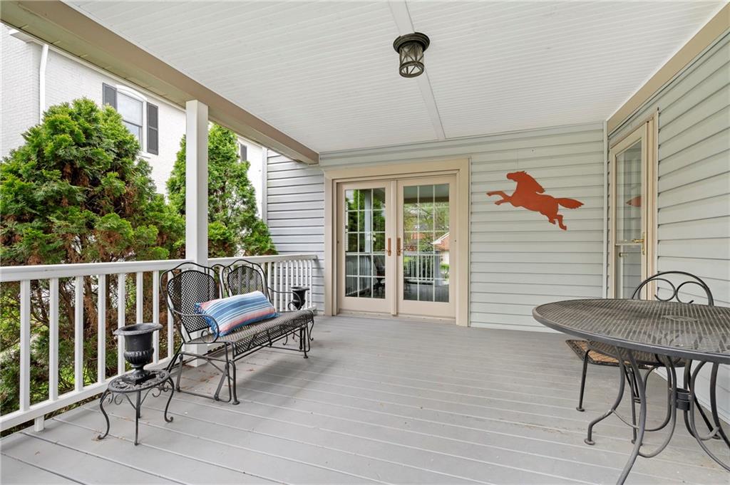 212 Pine Road Sewickley, PA 15143 - Photo 26 of 33 The covered deck connects directly to the dining room through French doors, making outdoor dining and entertaining effortless. A comfortable, sheltered space to enjoy morning coffee or unwind at the end of the day.