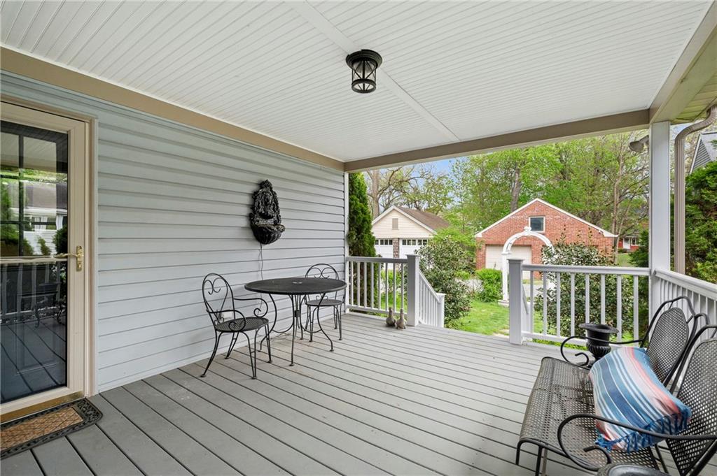 212 Pine Road Sewickley, PA 15143 - Photo 3 of 33 The covered back deck offers a private outdoor space for dining, relaxing, or enjoying fresh air in any weather. A natural extension of the home that supports easy indoor-outdoor living and everyday enjoyment.