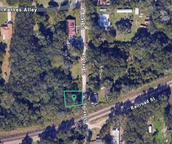 a view of a street with an outdoor space