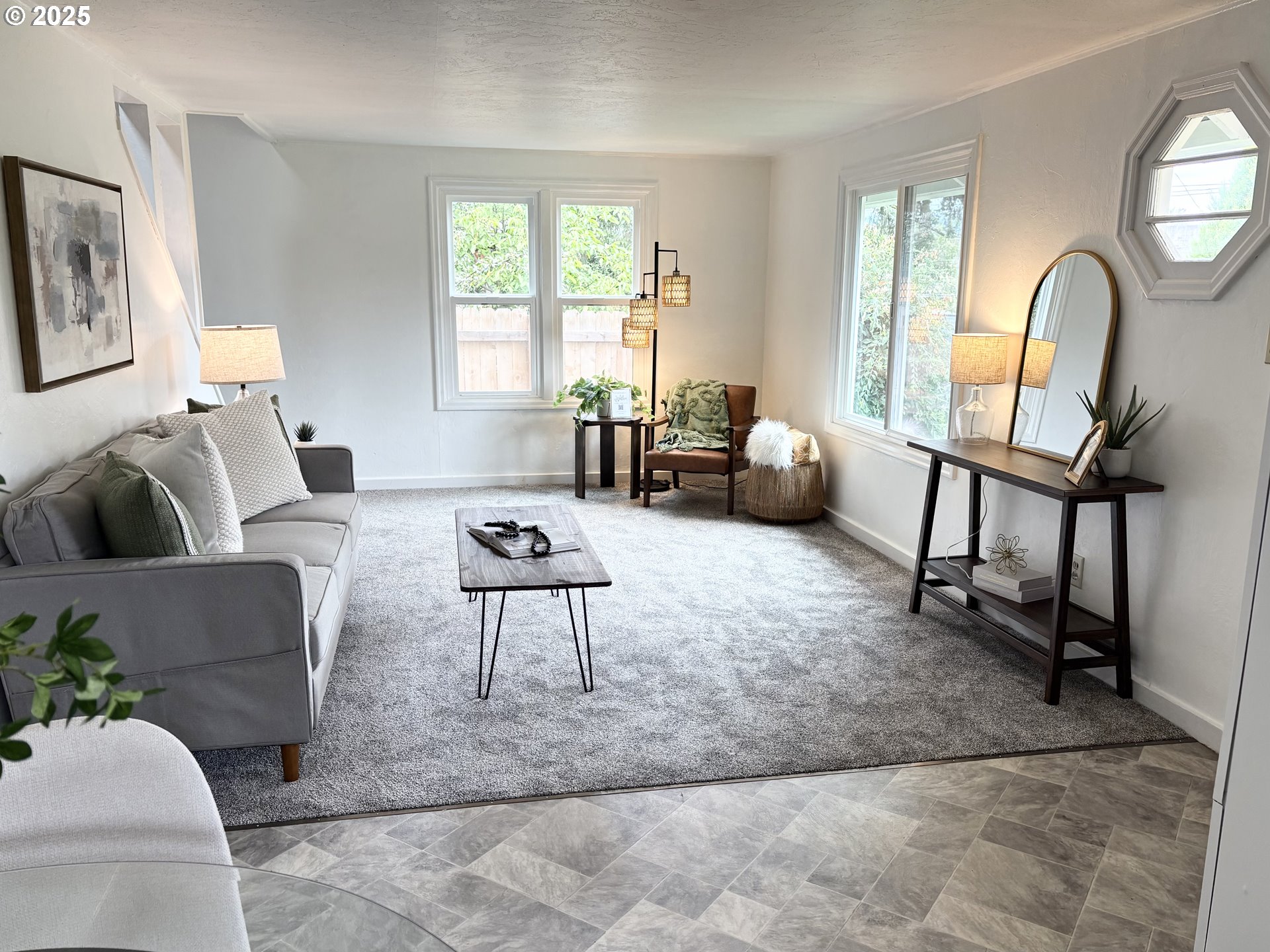 1730 Augusta Street Eugene, OR 97403 - Photo 4 of 11 a living room with furniture two window and a flat screen tv