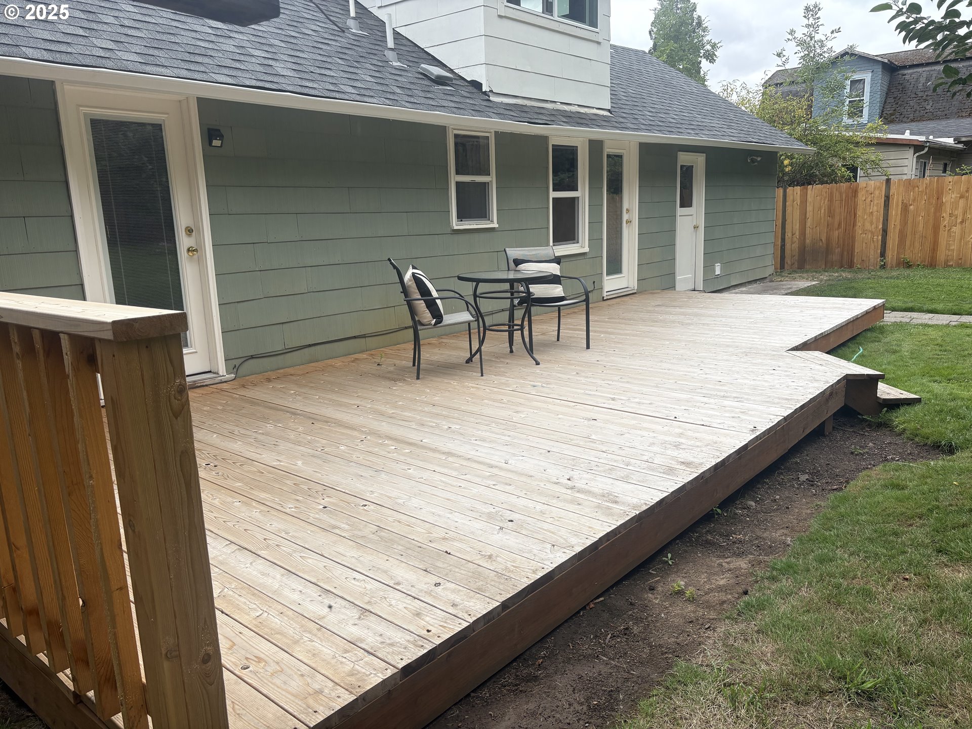 1730 Augusta Street Eugene, OR 97403 - Photo 7 of 11 a view of house with wooden deck and furniture