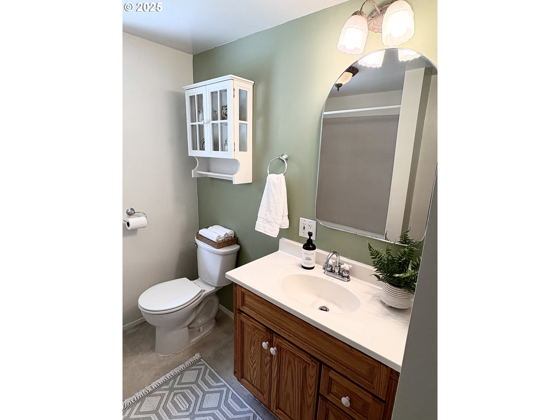 1730 Augusta Street Eugene, OR 97403 - Photo 9 of 11 a bathroom with a sink toilet and mirror