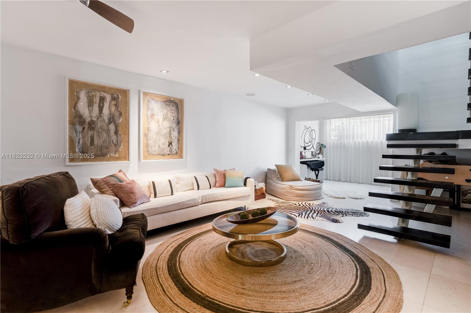 2000 South Bayshore Drive, Unit 47 Miami, FL 33133 - Photo 15 of 22 a living room with furniture and a fireplace