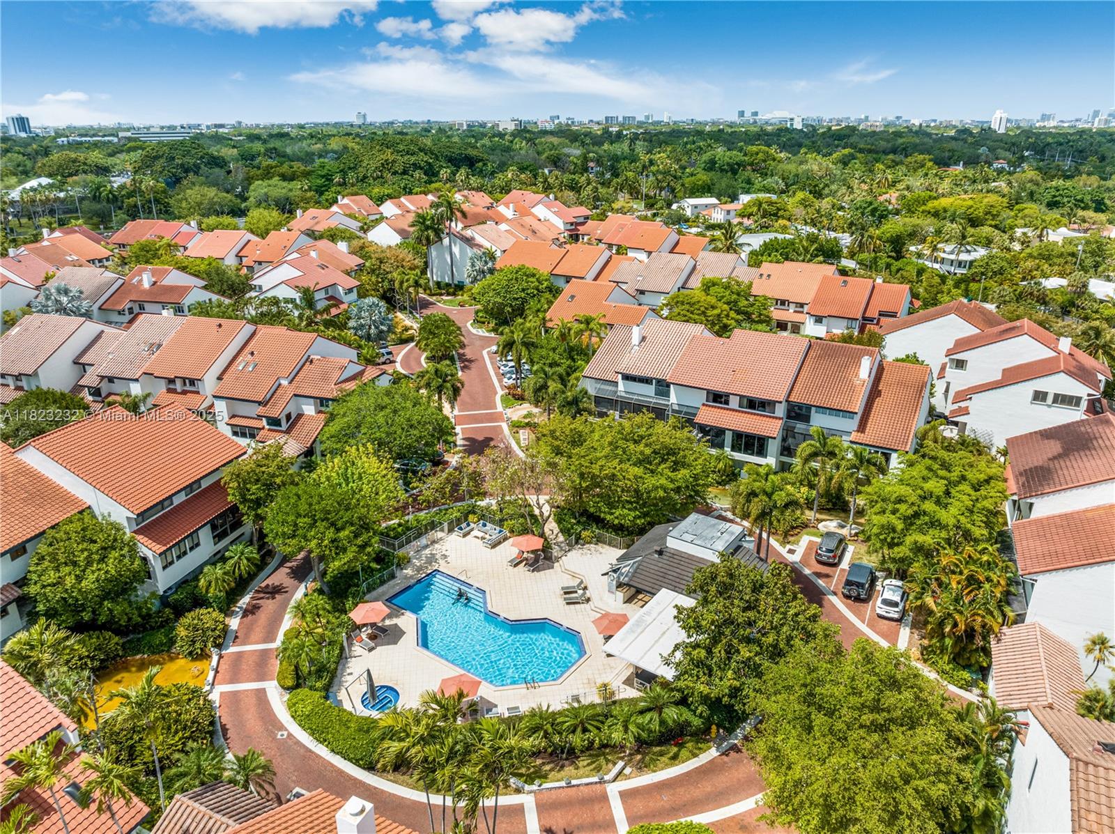 2000 South Bayshore Drive, Unit 47 Miami, FL 33133 - Photo 17 of 22 an aerial view of residential houses with outdoor space and trees