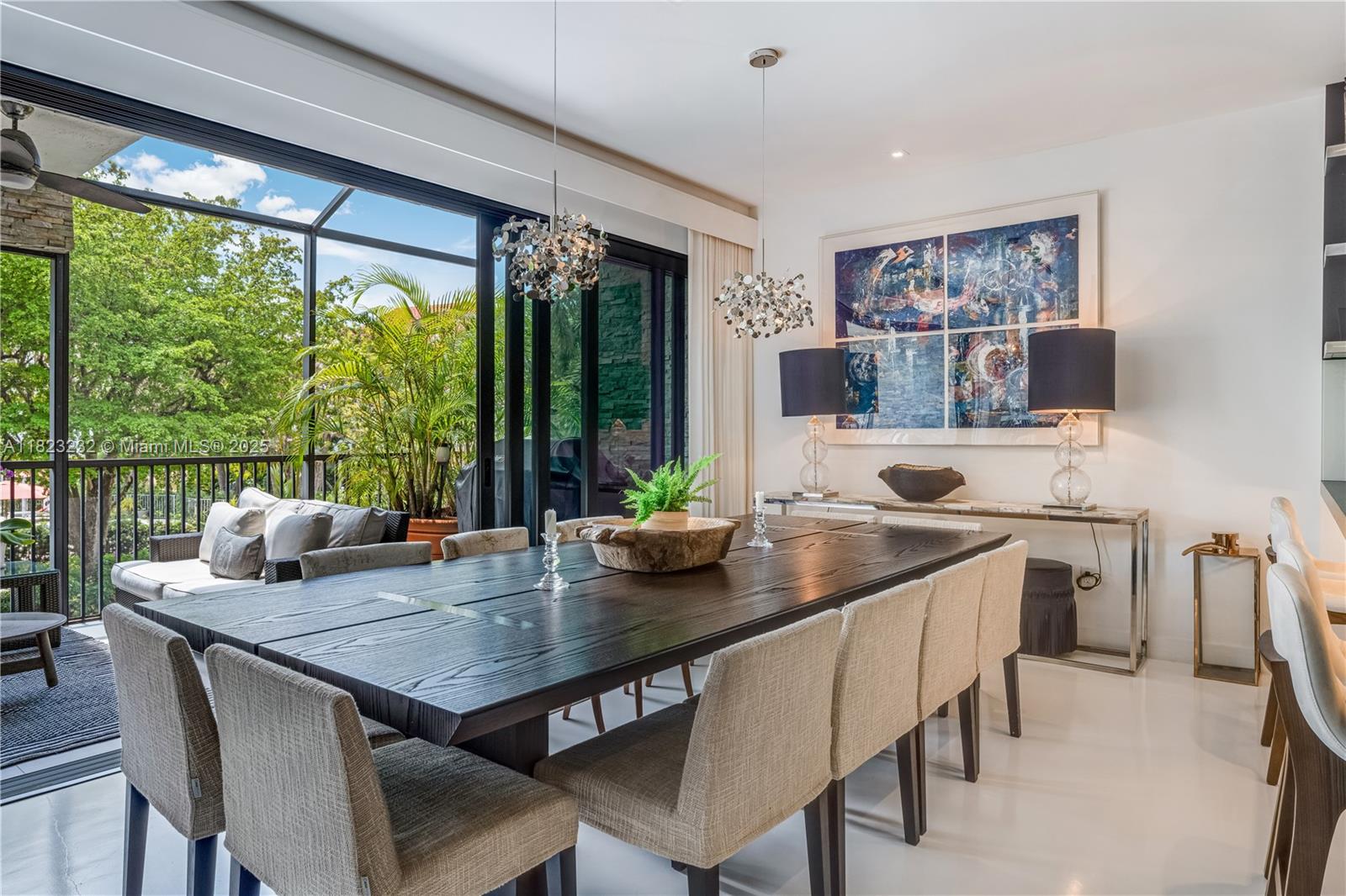 2000 South Bayshore Drive, Unit 47 Miami, FL 33133 - Photo 6 of 22 a kitchen with a table chairs and wooden floor